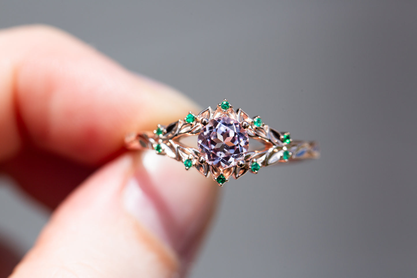 Briar rose solitaire with lab pink center and emerald accents