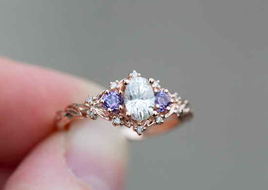 Briar rose three stone with moissanite and round lab purple sides