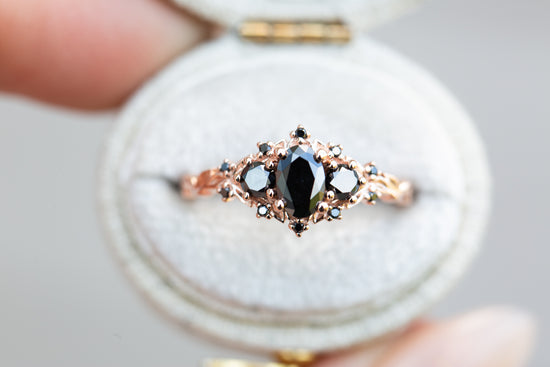 Briar rose three stone with oval black moissanite center and black diamonds