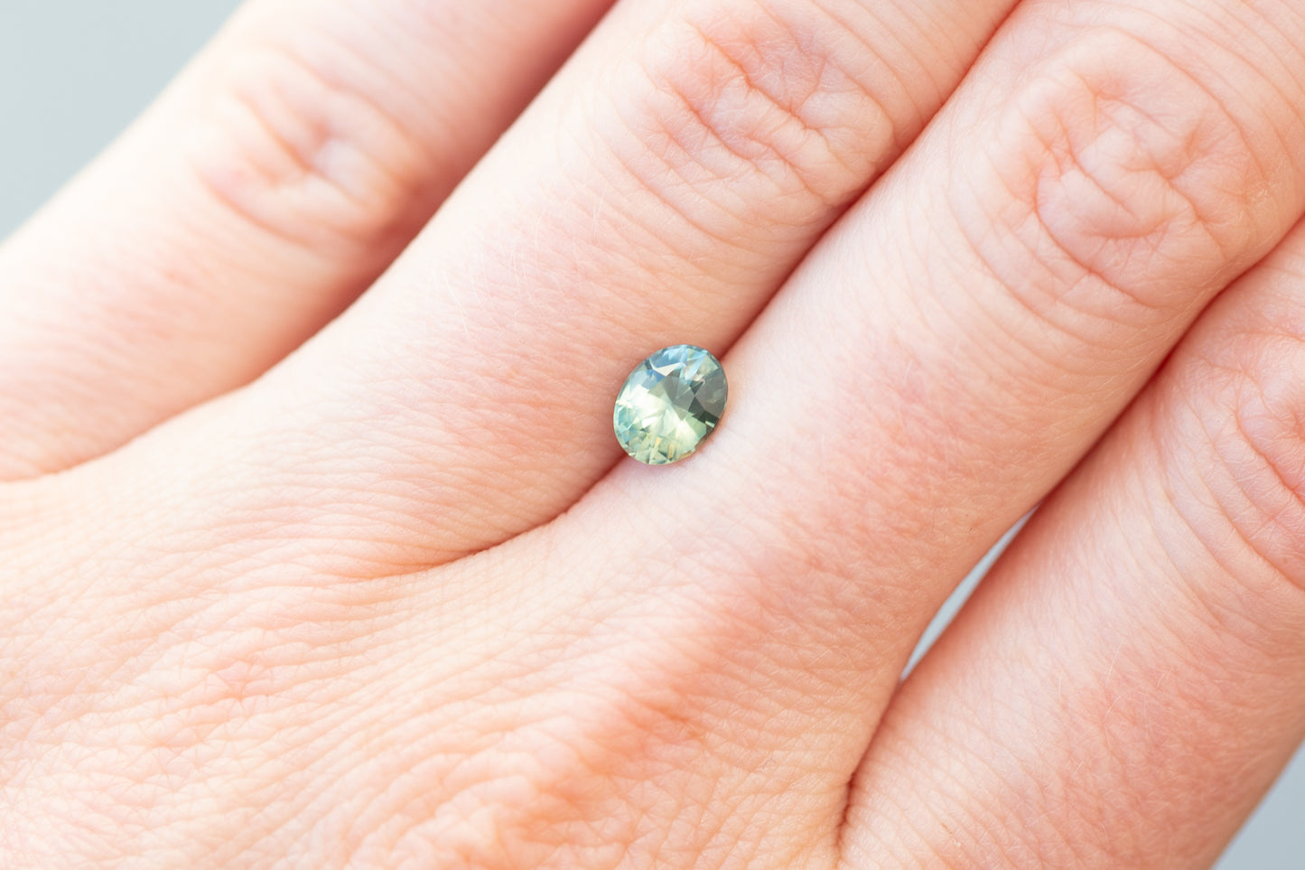 1.05ct Oval Light Green Teal Sapphire