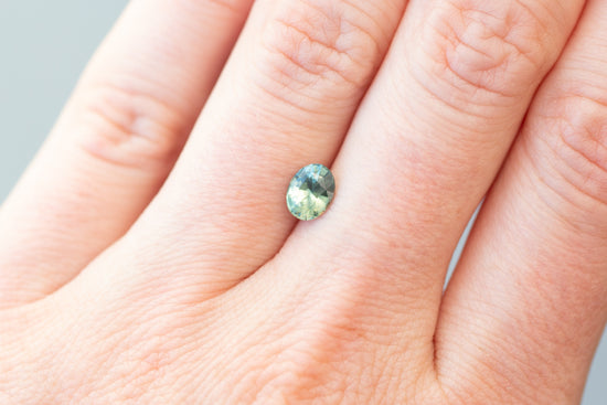 1.05ct Oval Light Green Teal Sapphire