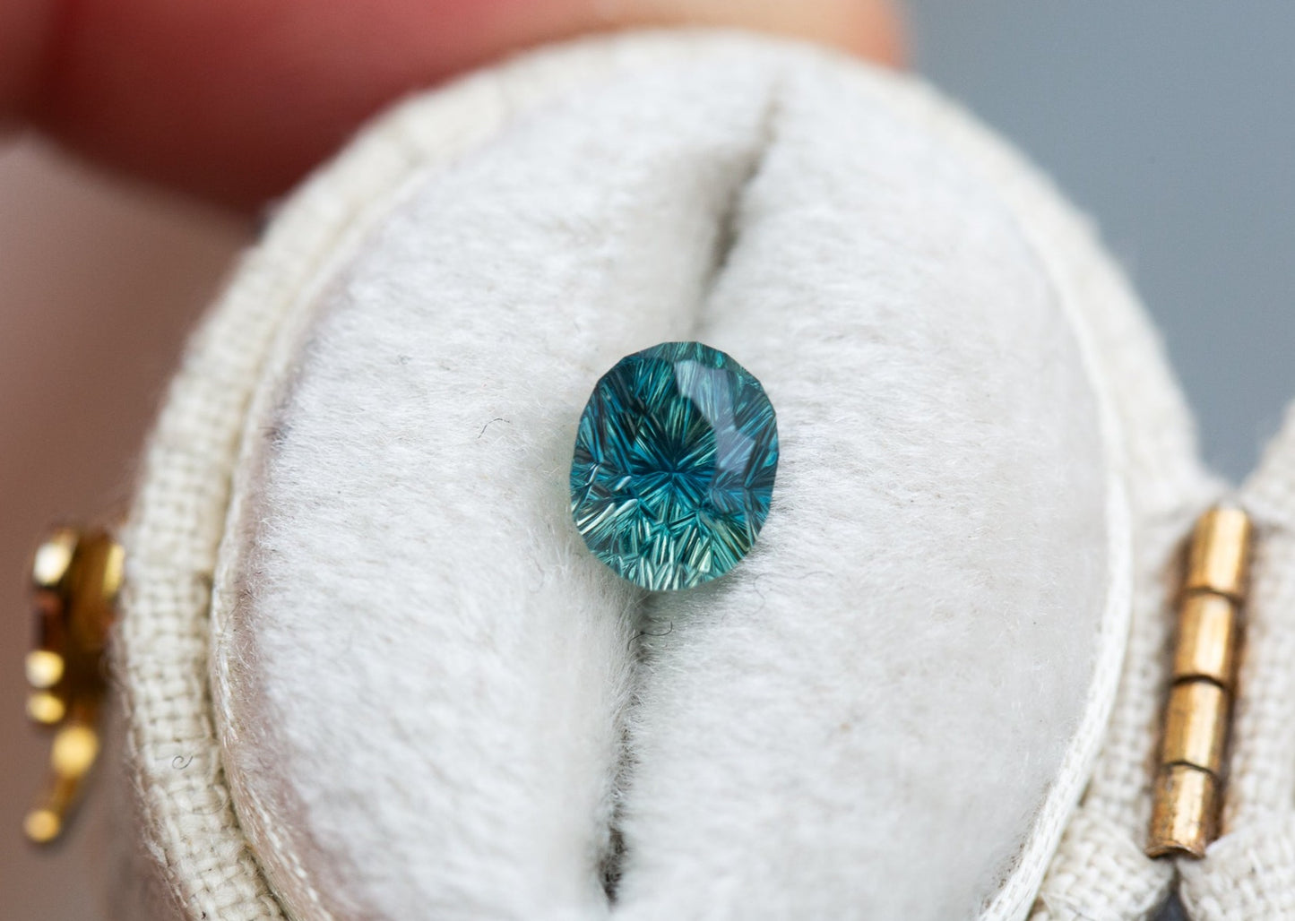 1.3ct teal concave cut sapphire by John Dyer