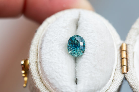 1.3ct teal concave cut sapphire by John Dyer