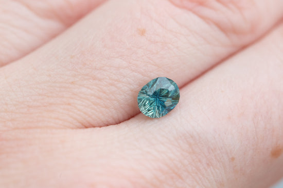 1.3ct teal concave cut sapphire by John Dyer