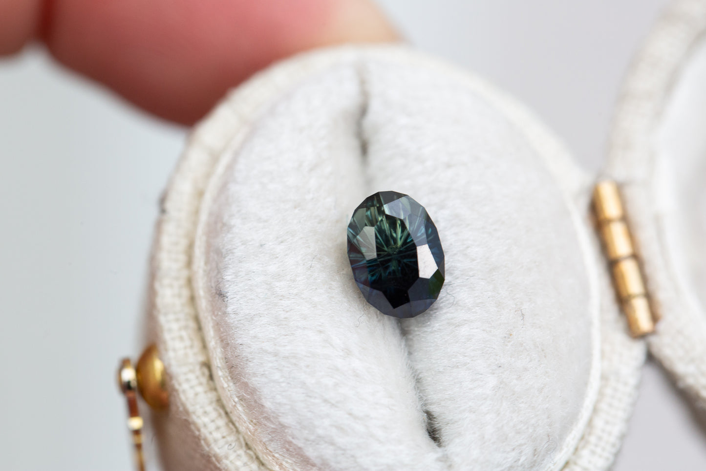 1.56ct oval dark blue green sapphire (almost black)-Starbrite cut by John Dyer