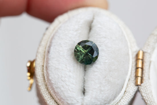 1.46ct round dark green sapphire- Starbrite cut