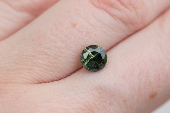 1.46ct round dark green sapphire- Starbrite cut
