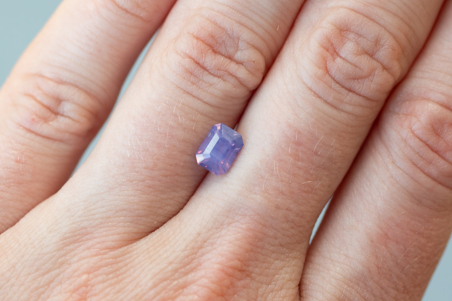 1.52ct Emerald Cut Opalescent Pinkish Purple Sapphire