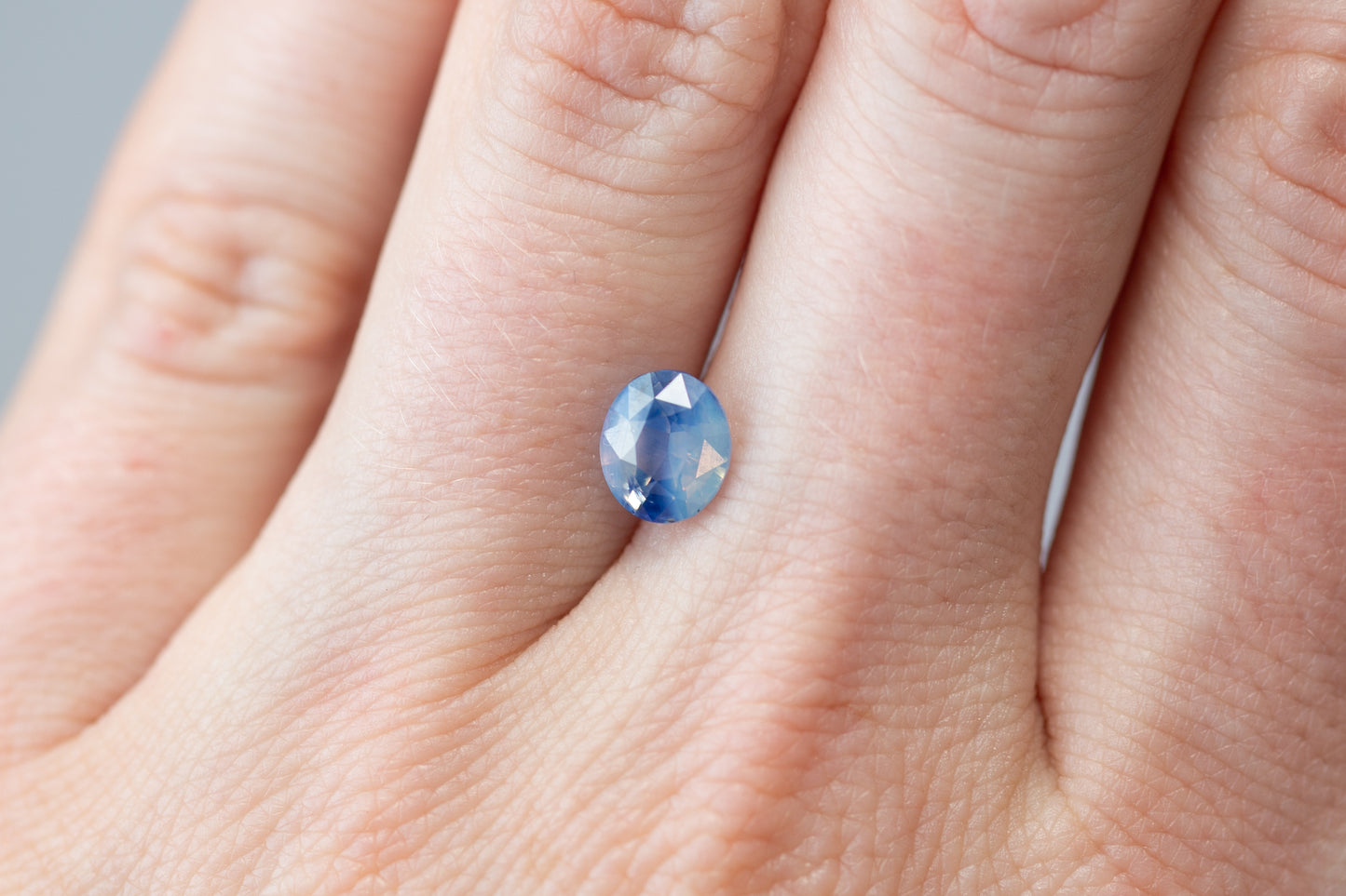 1.69ct Oval Bi-Color Opalescent Blue Sapphire