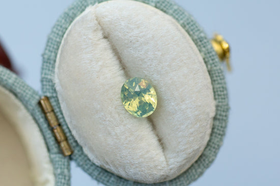 1.05ct Oval Opalescent Yellow Green Teal Sapphire