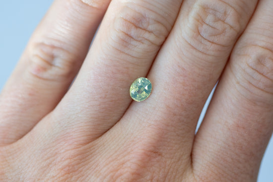 1.05ct Oval Opalescent Yellow Green Teal Sapphire