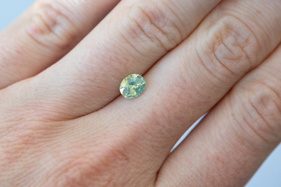 1.05ct Oval Opalescent Yellow Green Teal Sapphire