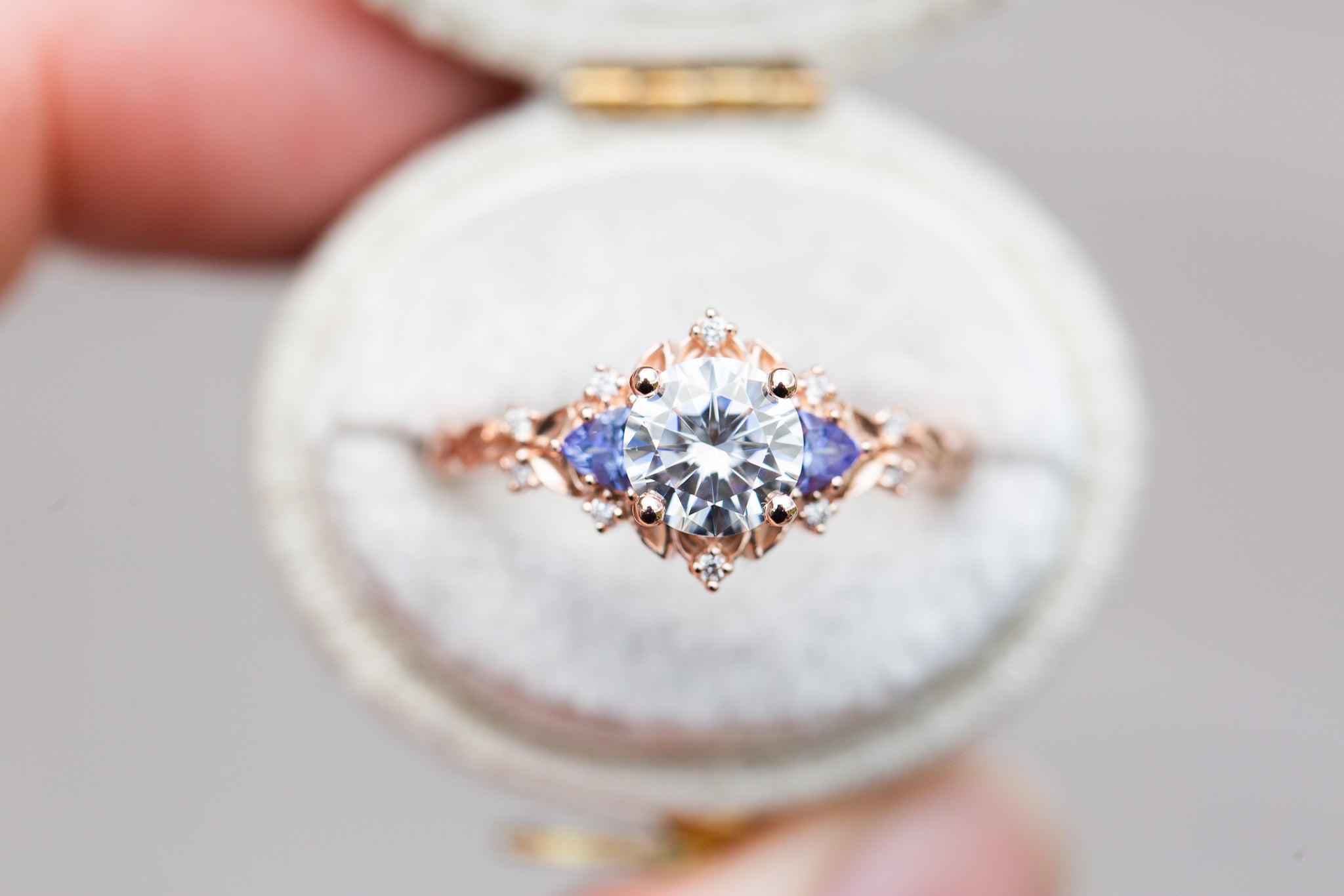 Briar rose three stone with round moissanite and tanzanite