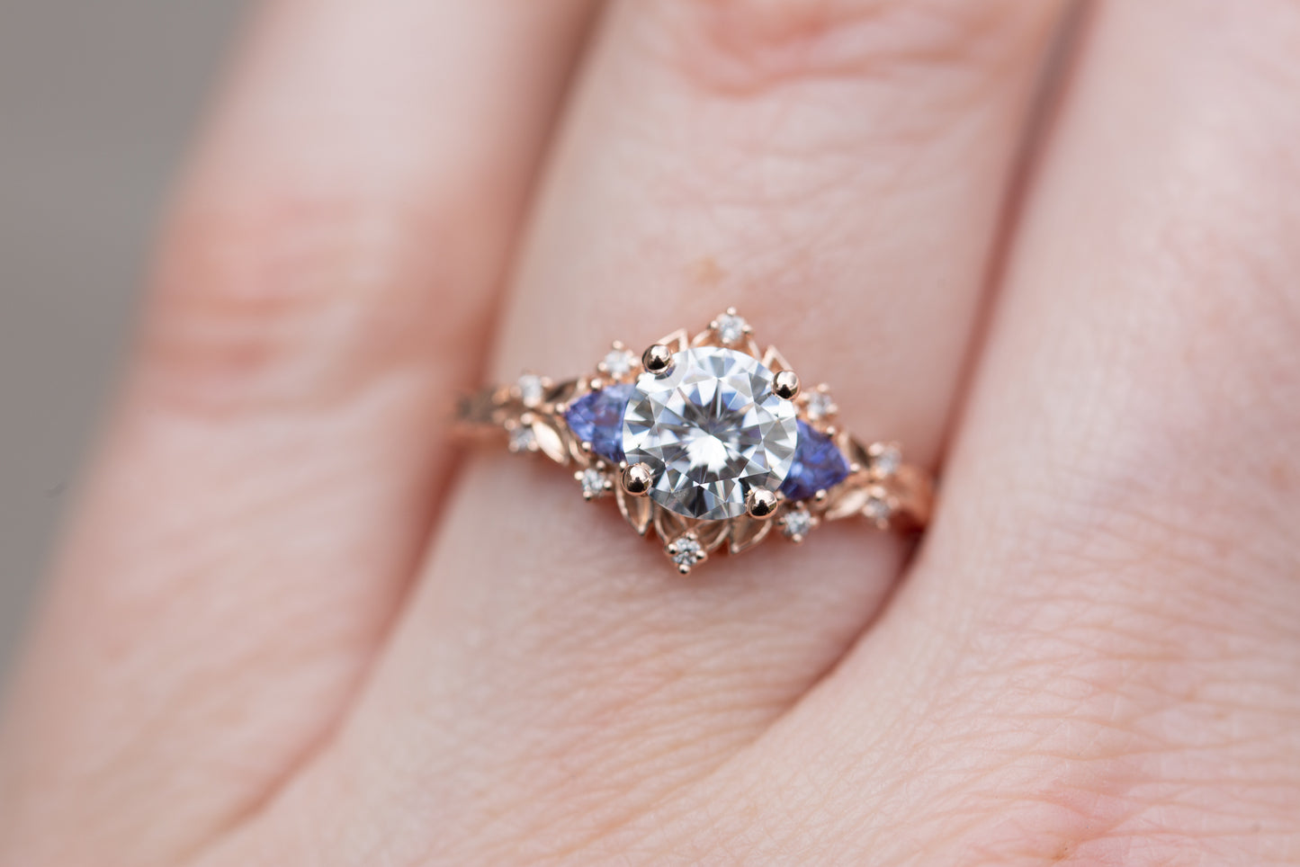 Load image into Gallery viewer, Briar rose three stone with round moissanite and tanzanite
