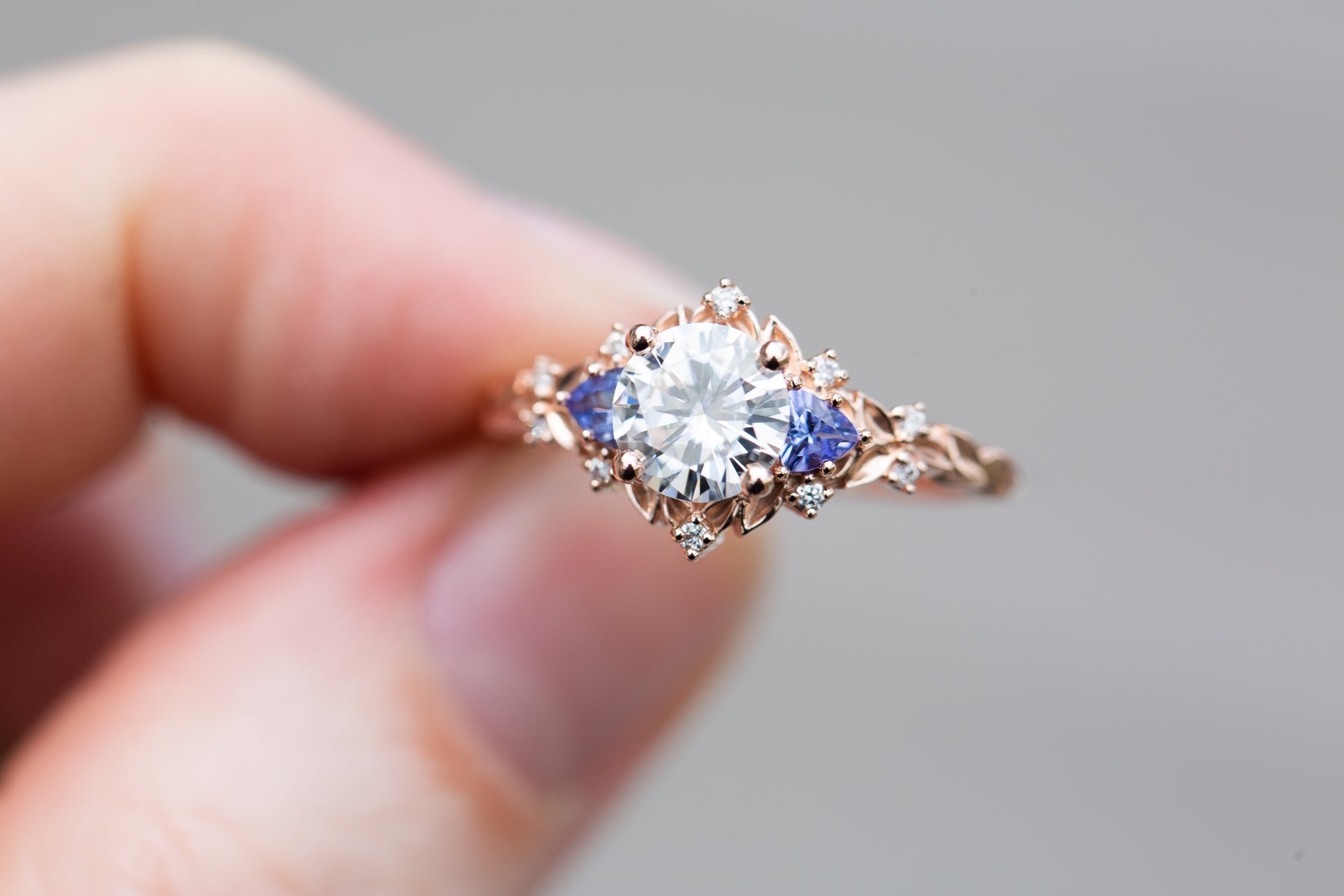 Briar rose three stone with round moissanite and tanzanite
