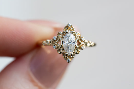 Aurora moon setting with marquise moissanite