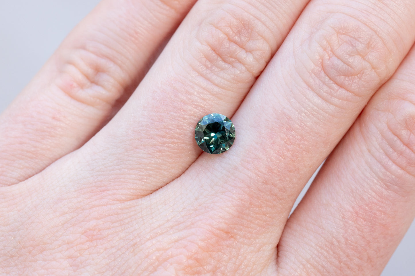 1.34ct Round Deep Teal Green Sapphire