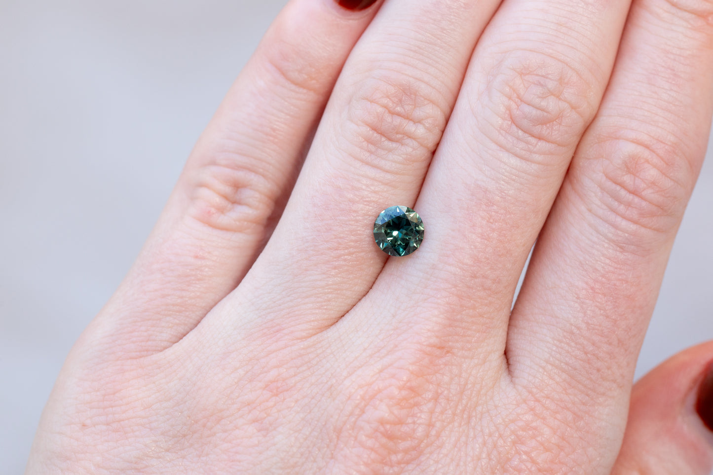 1.34ct Round Deep Teal Green Sapphire