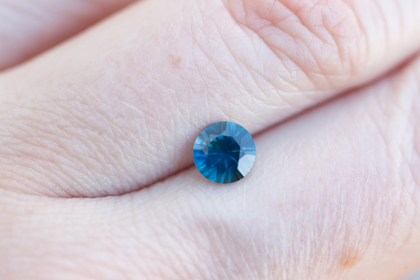 .95ct round opaque blue teal sapphire