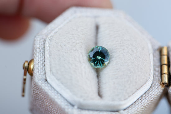 .72ct round teal green sapphire