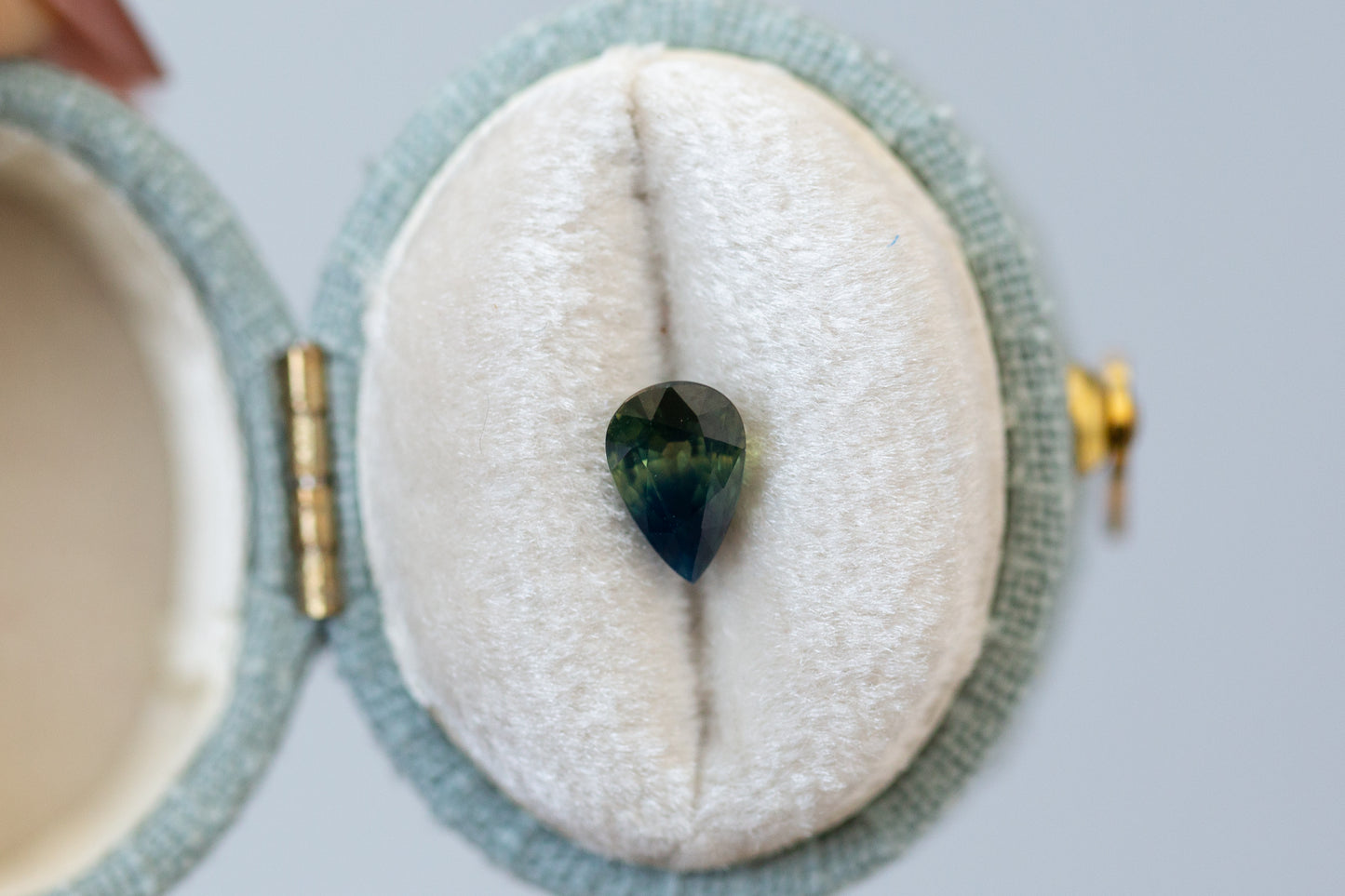 1.08ct Pear Deep Green and Opalescent Blue Sapphire