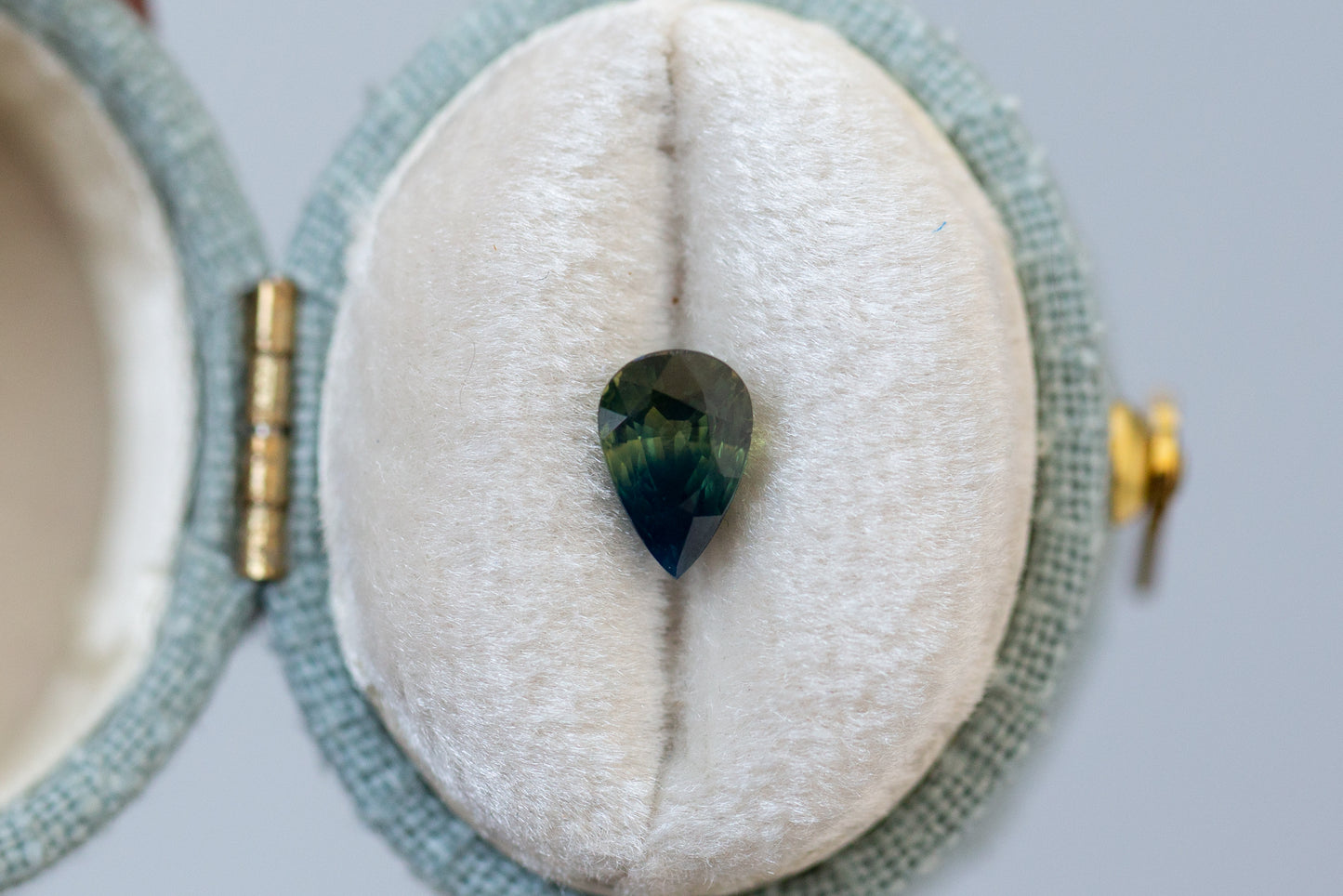 1.08ct Pear Deep Green and Opalescent Blue Sapphire