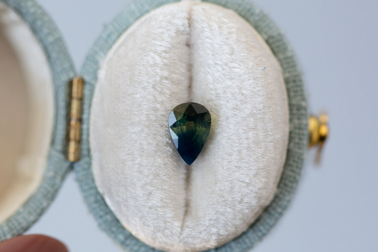 1.08ct Pear Deep Green and Opalescent Blue Sapphire