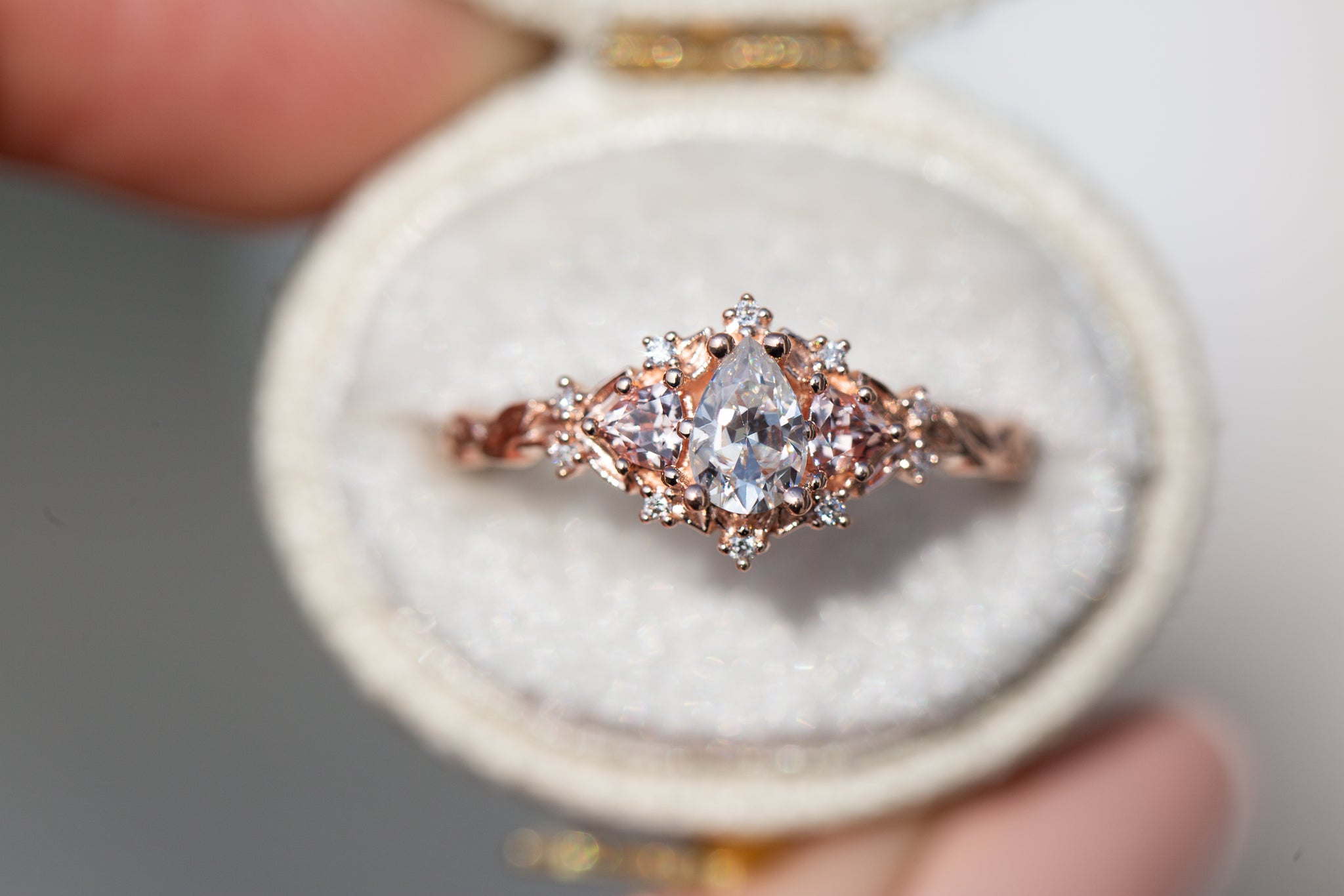 Briar Rose Three Stone with pear moissanite and peach sapphire