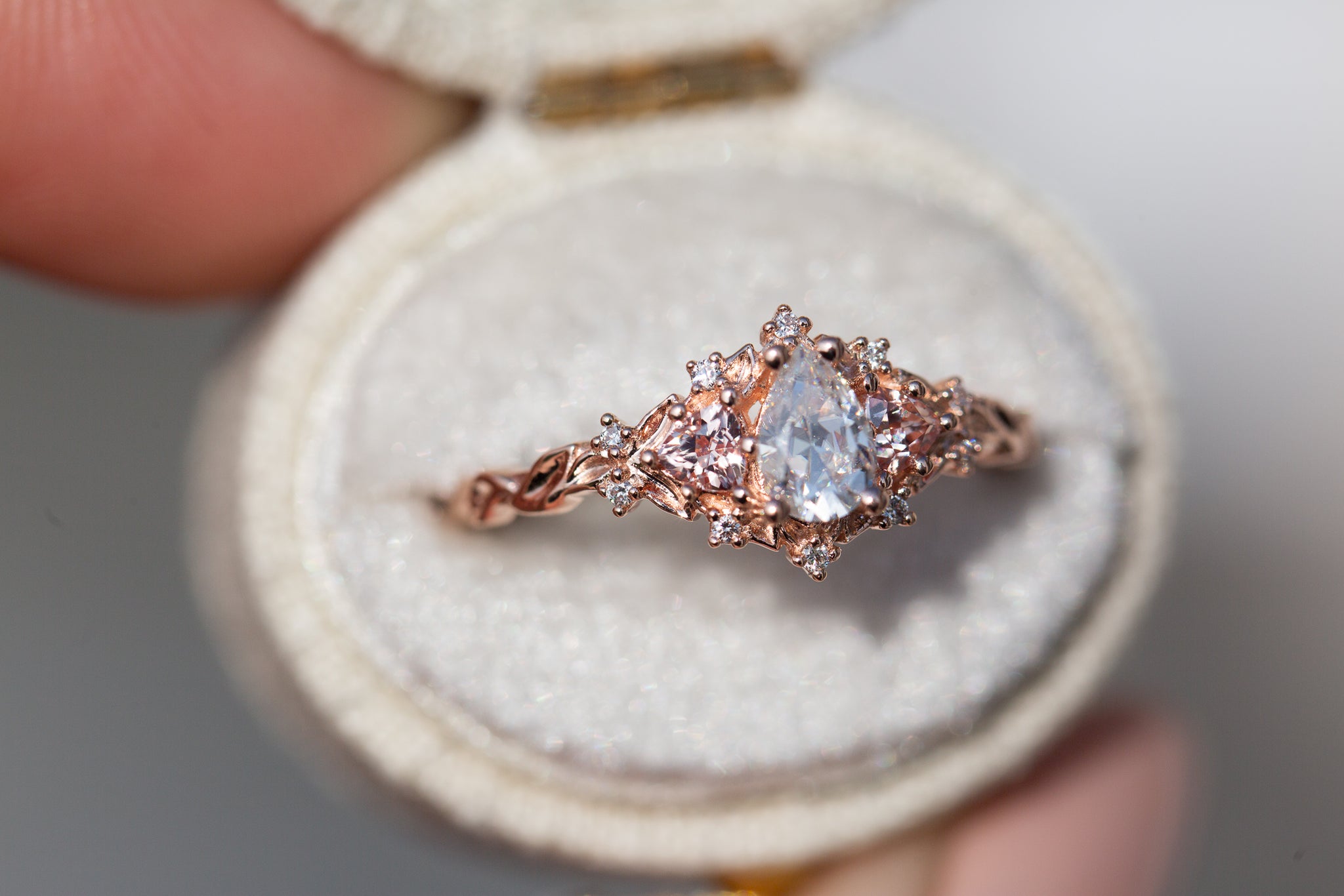 Briar Rose Three Stone with pear moissanite and peach sapphire