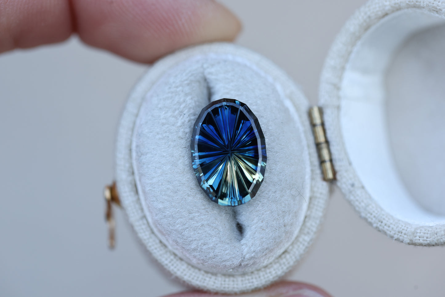 4.45ct oval parti sapphire, Starbrite cut by John Dyer