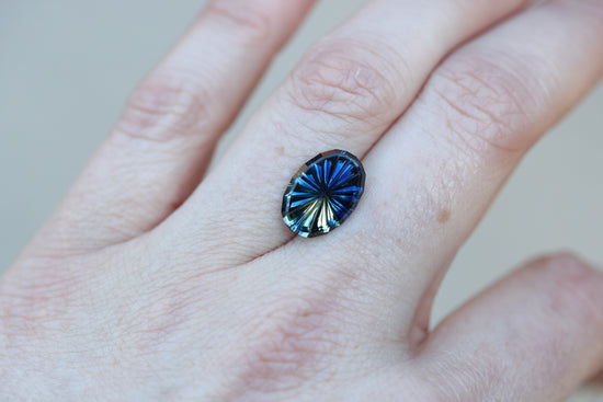 4.45ct oval parti sapphire, Starbrite cut by John Dyer