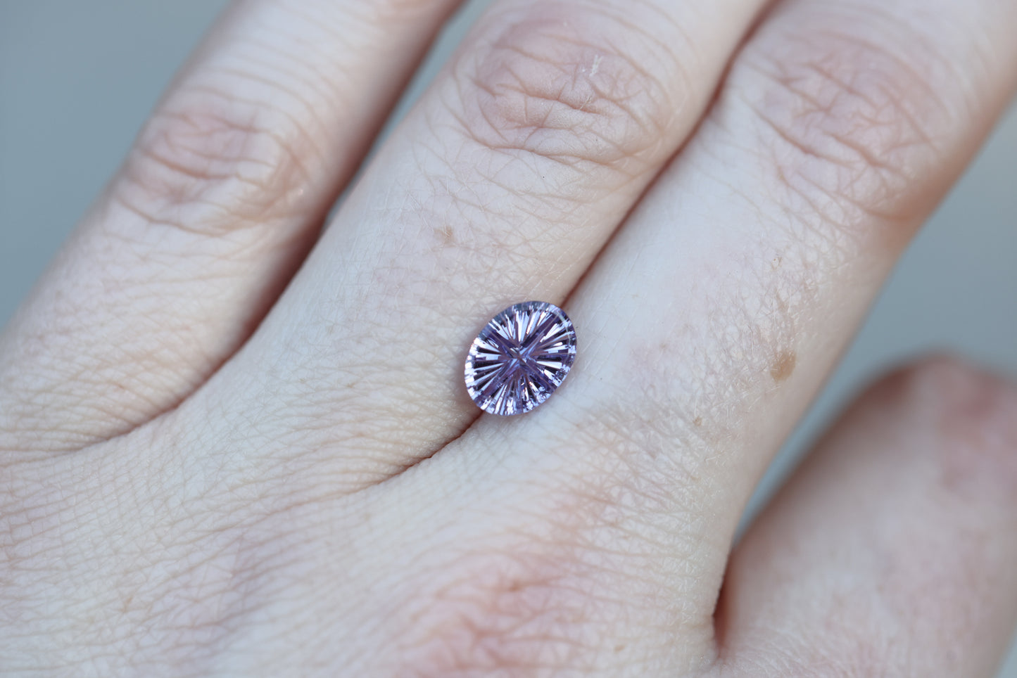 1.36ct oval purple sapphire, Starbrite cut by John Dyer