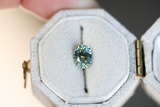 .98ct oval parti teal yellow sapphire