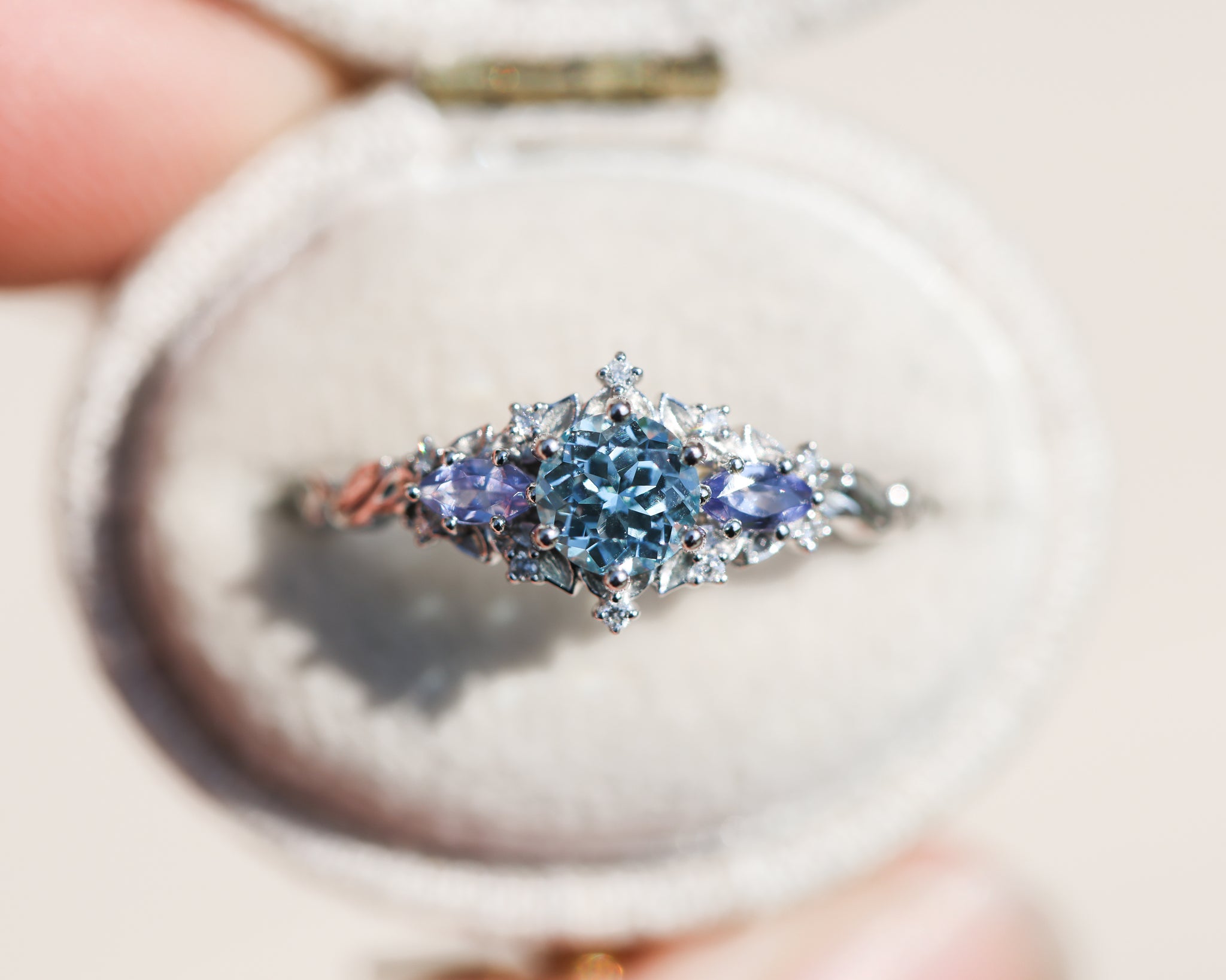 Briar Rose Three Stone with round aquamarine center and marquise