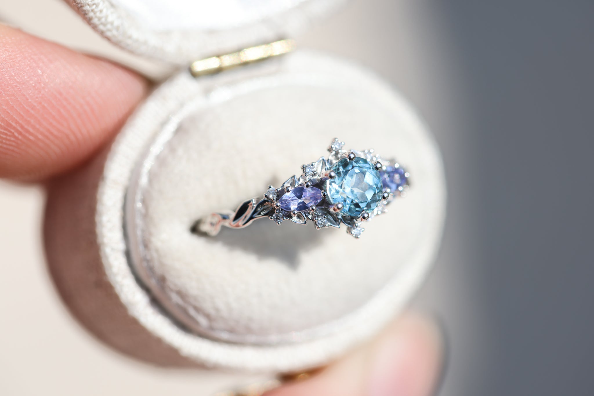 Briar Rose Three Stone with round aquamarine center and marquise