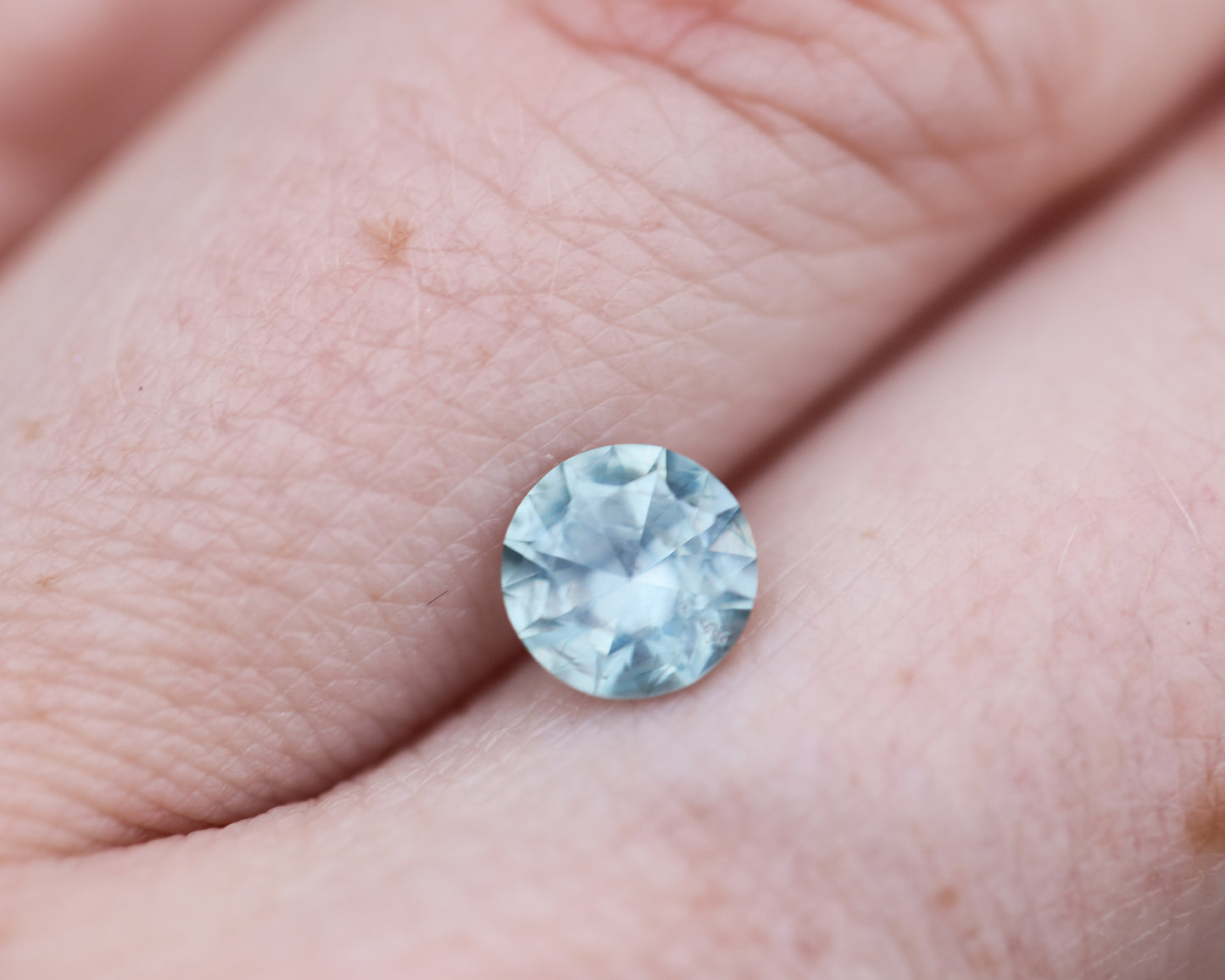 1.26ct round opaque teal blue sapphire