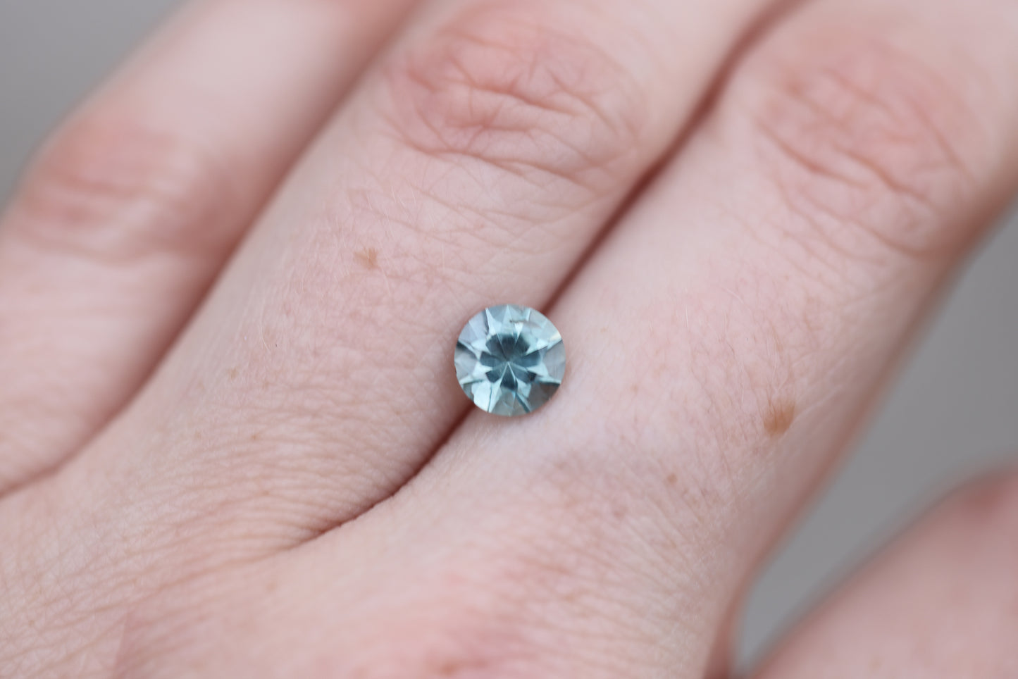 1.33ct round opaque teal blue sapphire