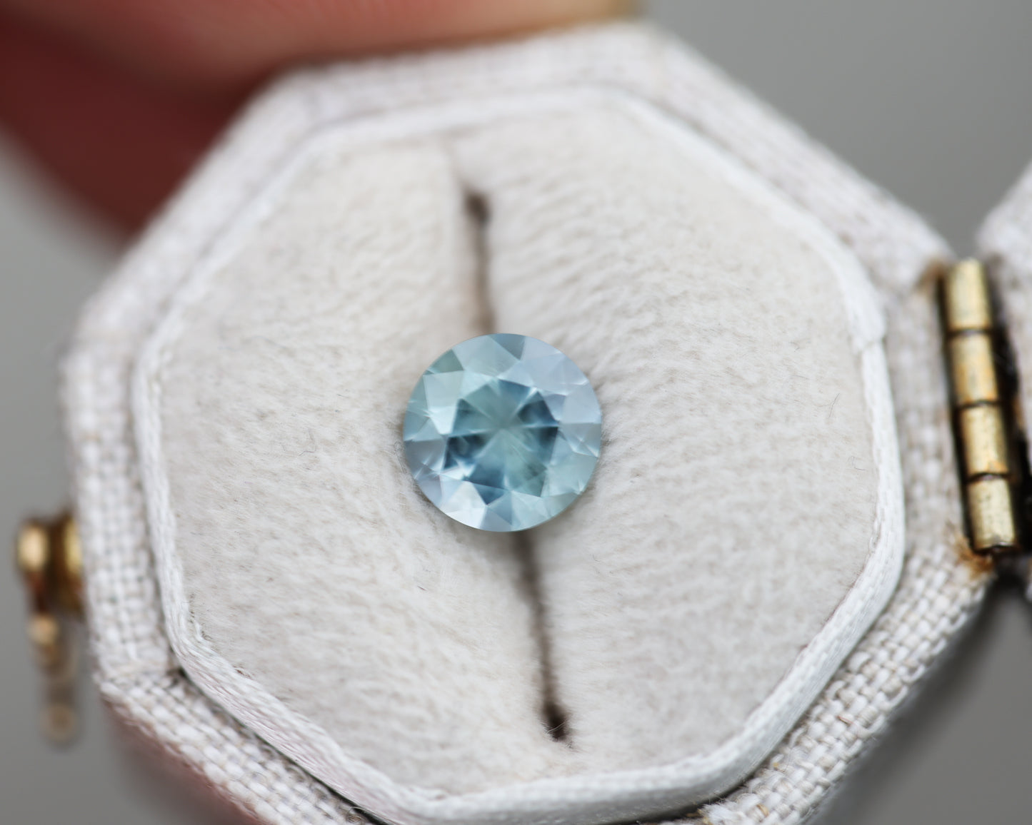 1.36ct round opaque medium blueish sapphire