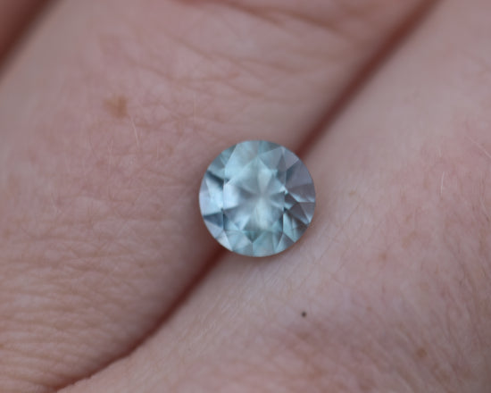 1.36ct round opaque medium blueish sapphire