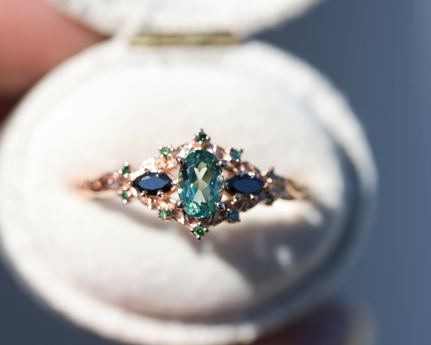 Load image into Gallery viewer, Briar rose three stone with lab green sapphire and black/green diamond sides
