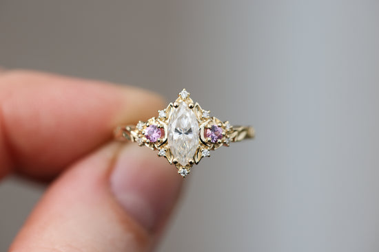 Briar moon three stone with marquise moissanite and round pink sapphire side stones