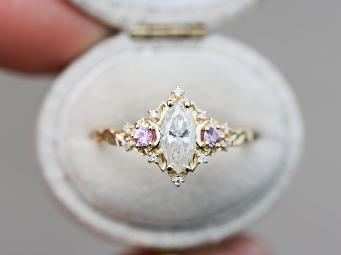 Customize your own Briar moon three stone with marquise center and round sides