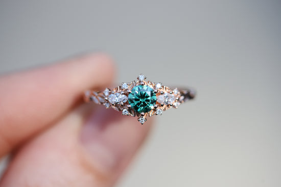 Briar rose three stone with round green moissanite