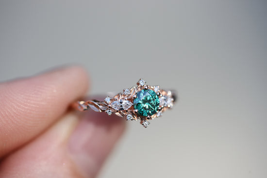 Briar rose three stone with round green moissanite