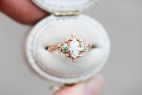 Briar rose three stone with marquise moissanite and mint green diamonds