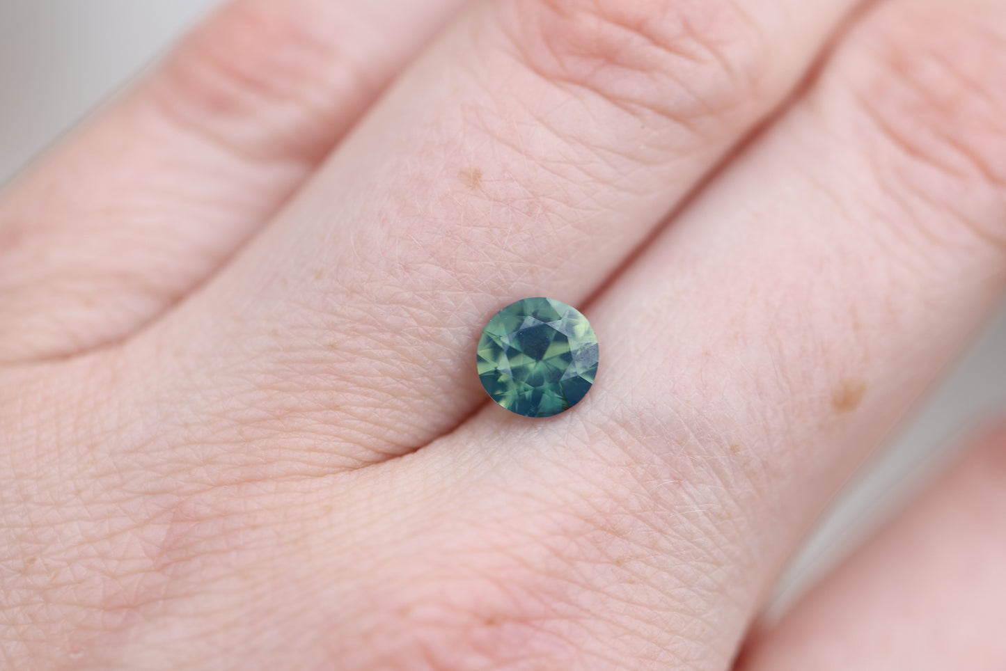 1.7ct round opaque green teal sapphire