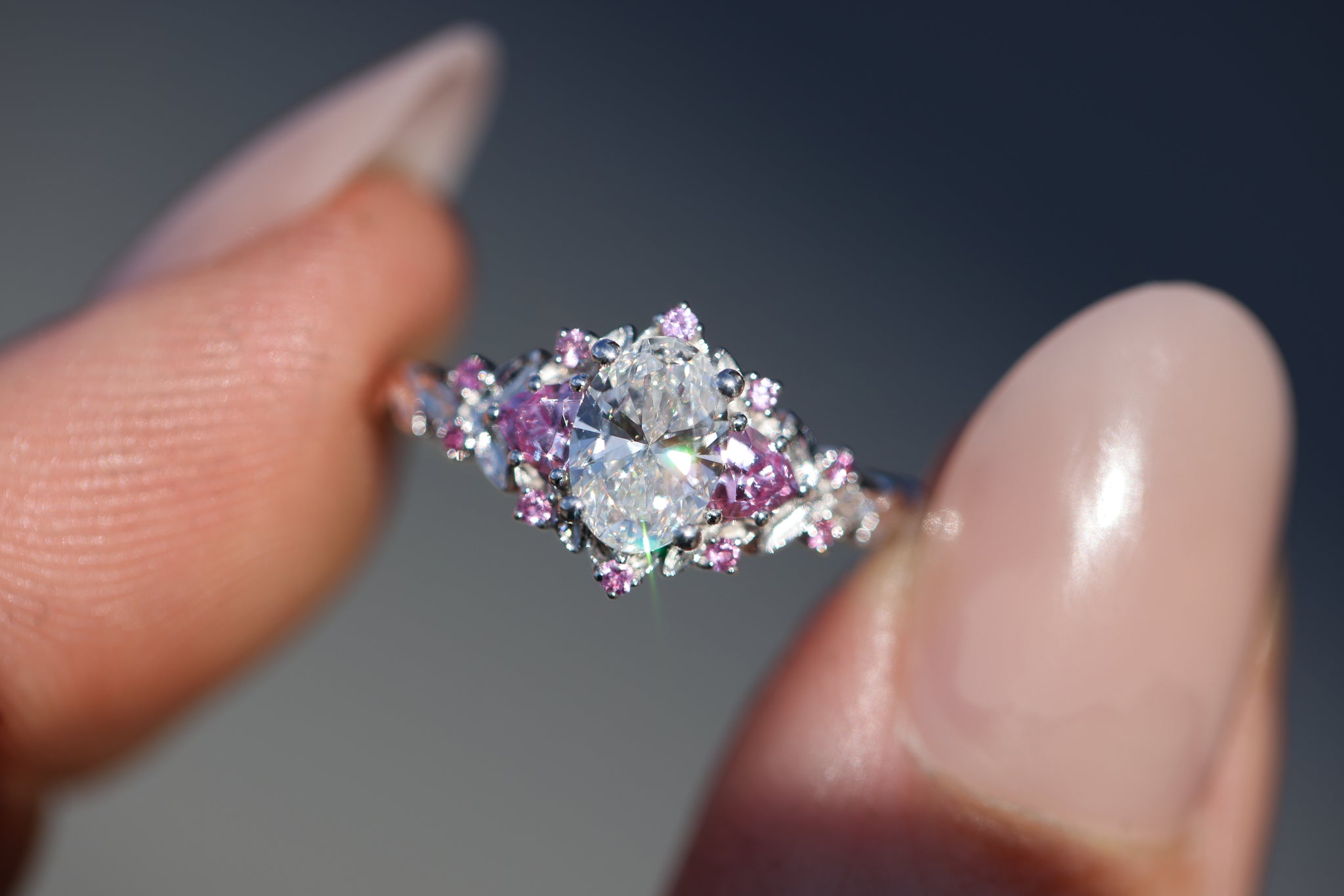 Briar Rose Three Stone with 7x5mm oval lab diamond center and pink