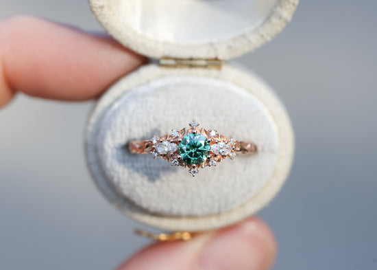 Briar rose three stone with round green moissanite