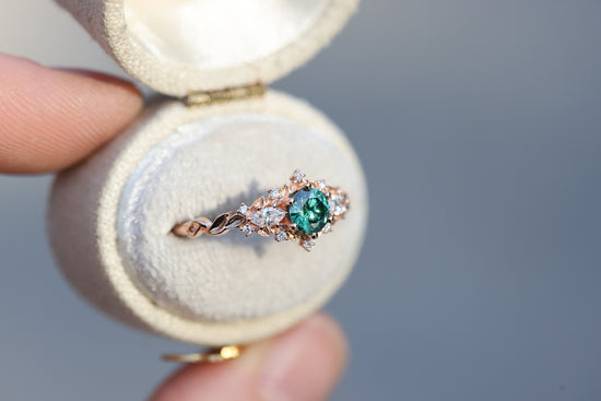 Briar rose three stone with round green moissanite