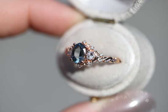 Briar rose three stone with 7x5mm oval grey spinel center
